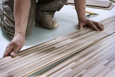 Craftsman installing floor Hammer and nails on floor