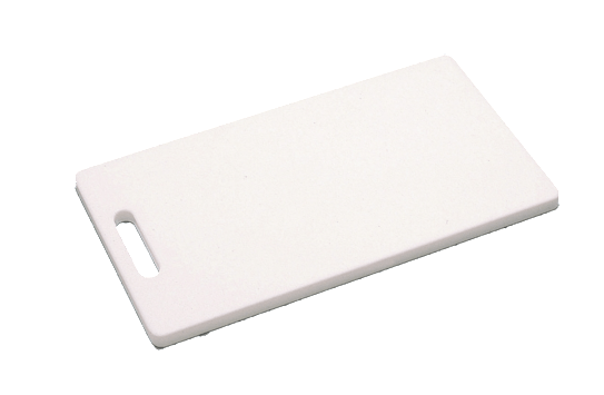 A white plastic cutting board with a handle on a white background.