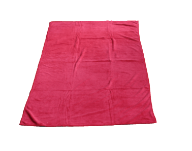 A red blanket is laying on a white surface