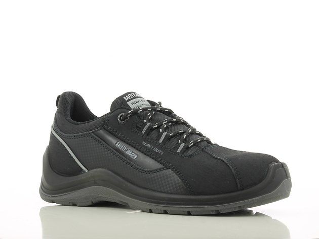 A pair of black safety shoes are sitting on a white surface.