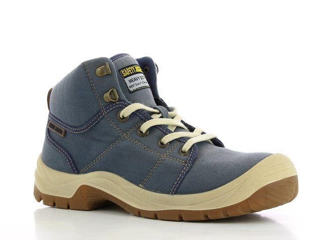 A pair of blue safety boots with white laces on a white surface.
