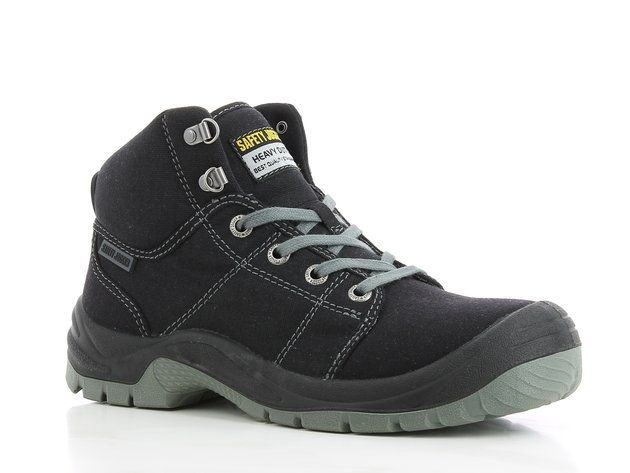 A pair of black and green safety boots on a white background.