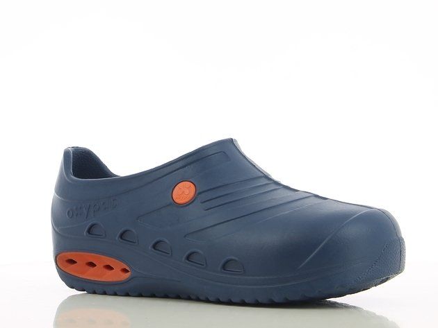 A pair of blue and orange shoes on a white surface.