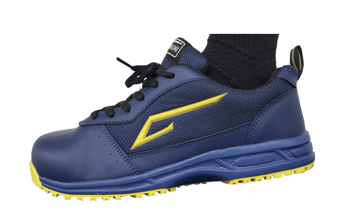 A person is wearing a pair of blue and yellow safety shoes.
