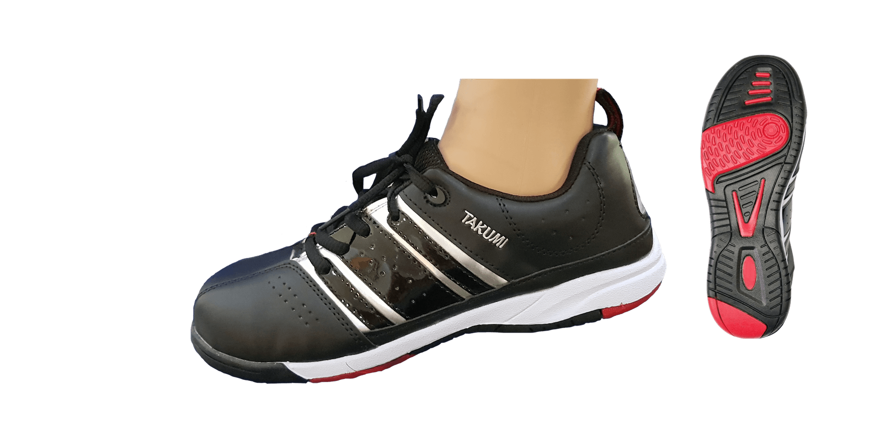 A person is wearing a pair of black and red tennis shoes.