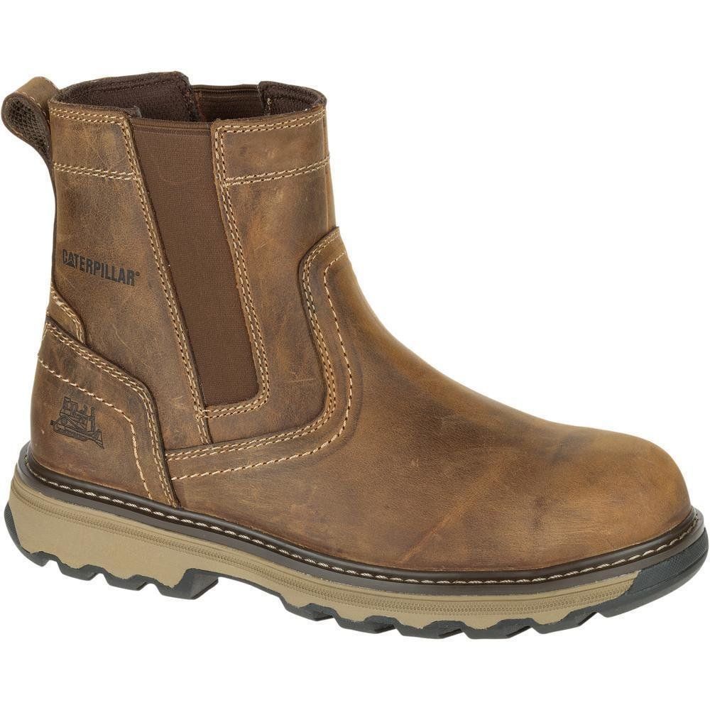 A pair of brown caterpillar boots on a white background