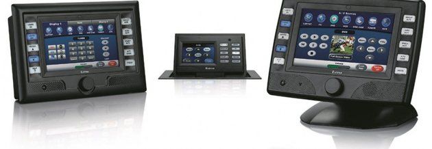 Three black touchscreen devices on a white surface. The devices have similar interfaces and controls.