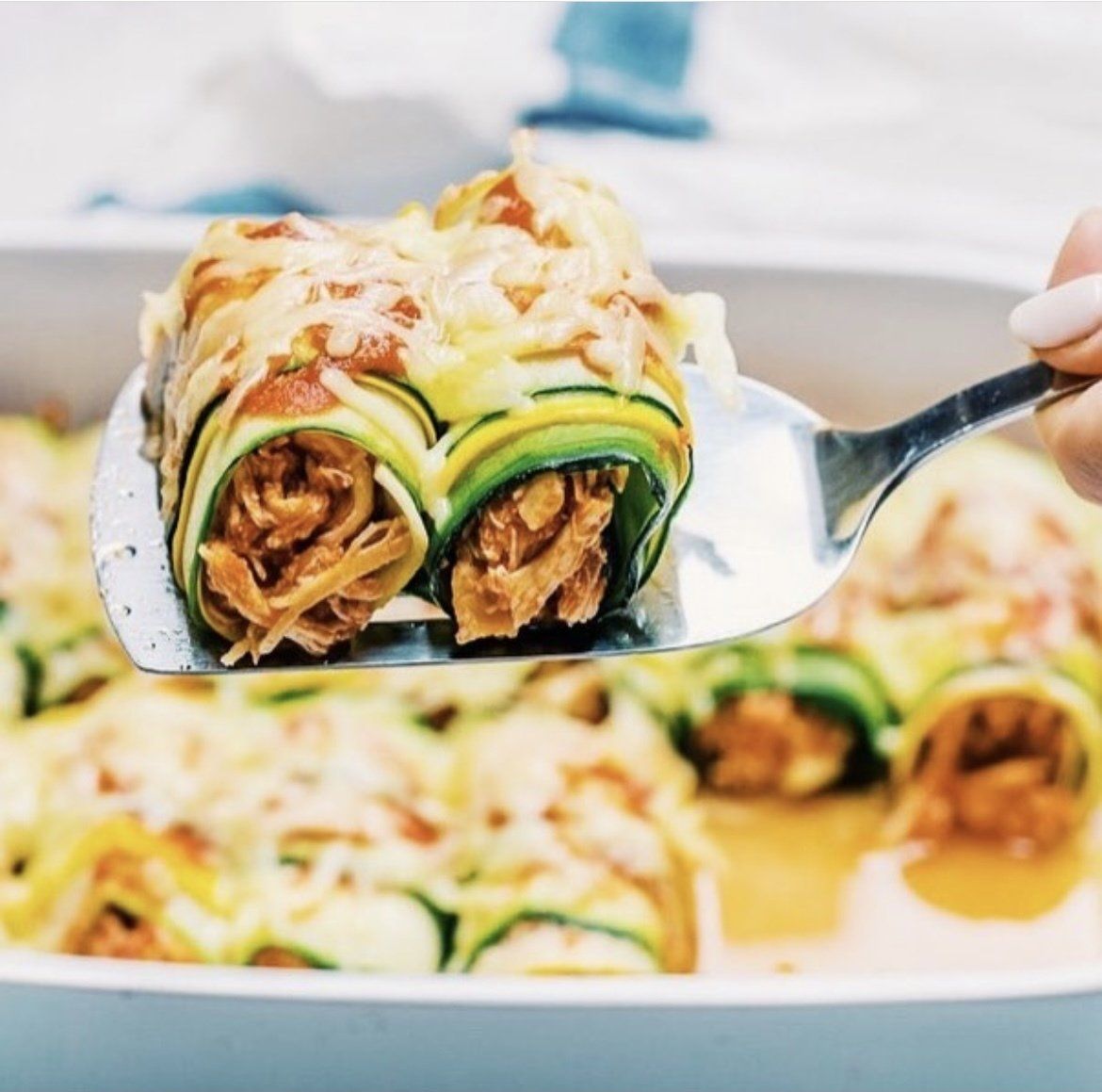 Zucchini Chicken Enchilada Roll-Ups recipe by emily moss of thrivyest