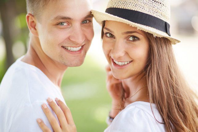 Happy Couple Smiling — Kansas City, MO — Koehn Dentistry & Aesthetics Happy Couple Smiling — Kansas City, MO — Koehn Dentistry & Aesthetics