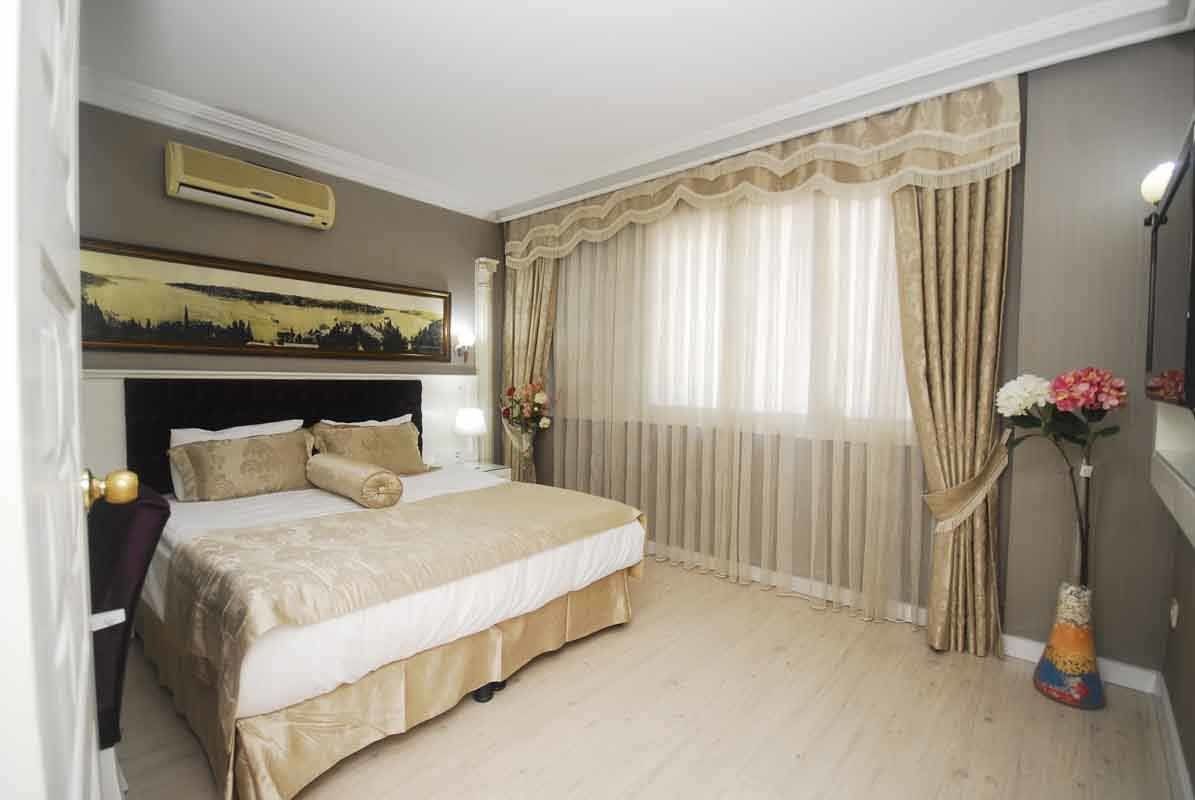 There is a large bed in the middle of the room.