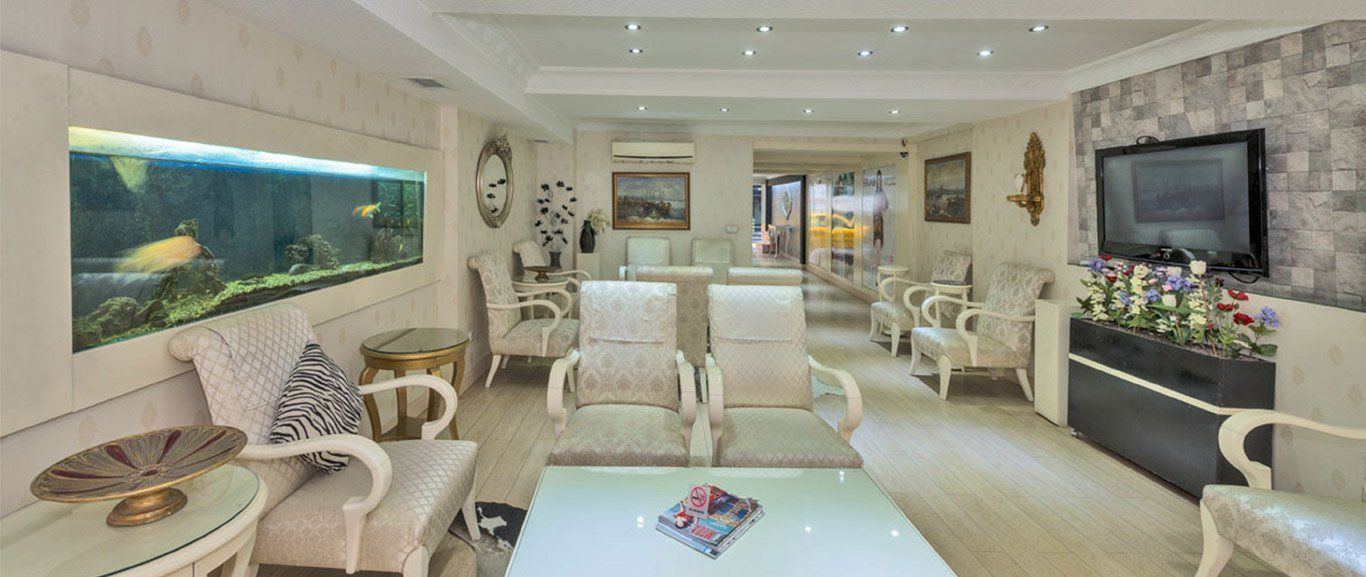 A living room filled with furniture and a fish tank.