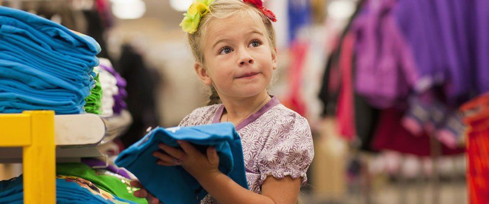 kid in the clothing store