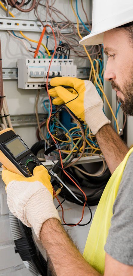 Wiring — Electrician Checking Electrical Box in Sumner, WA Wiring — Electrician Checking Electrical Box in Sumner, WA