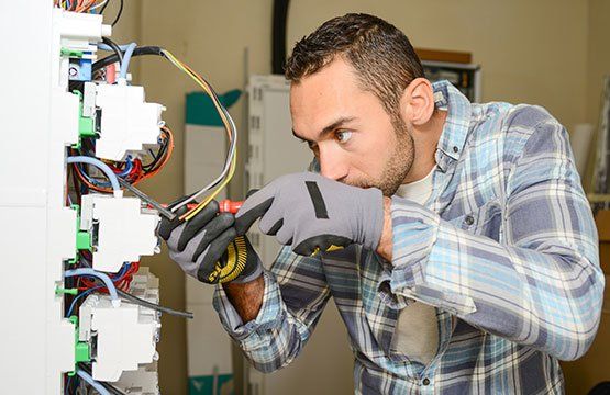 Electrical Troubleshooting — Electrician Checking the Wires in Sumner, WA Electrical Troubleshooting — Electrician Checking the Wires in Sumner, WA