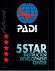 PADI 5 Star Instructor Development Center logo with a globe and red stars on a black background.
