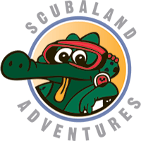 Scubaland Adventures logo: cartoon alligator wearing scuba mask and watch in front of a blue and orange circle.