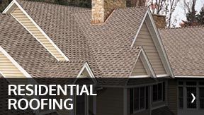 Residential Roofing Services — Residential House in Savannah, GA Residential roofing on a house with brown shingles.
