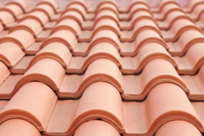 Clay tile roof with curved, interlocking tiles.