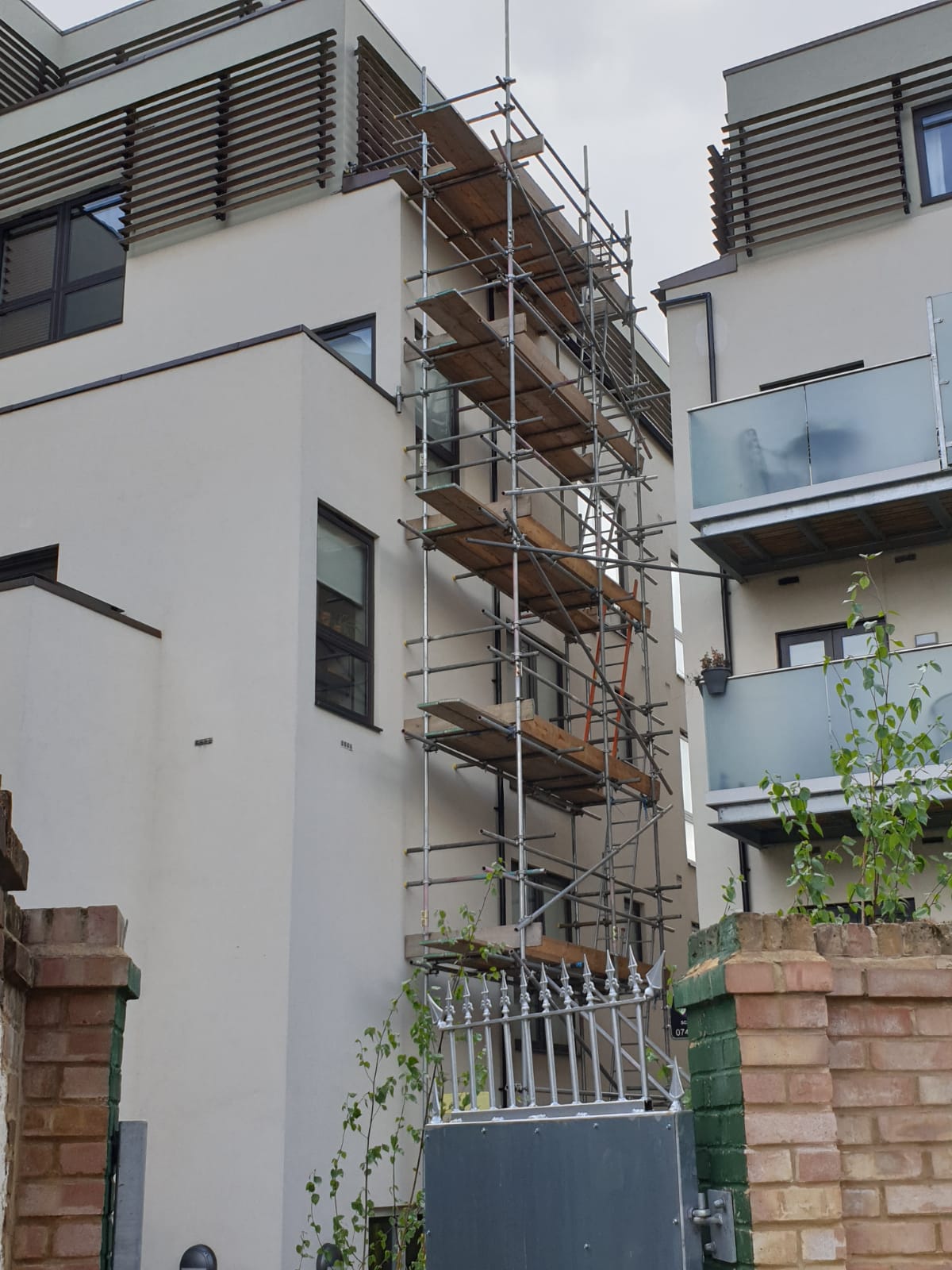 Scaffolding tower to access guttering