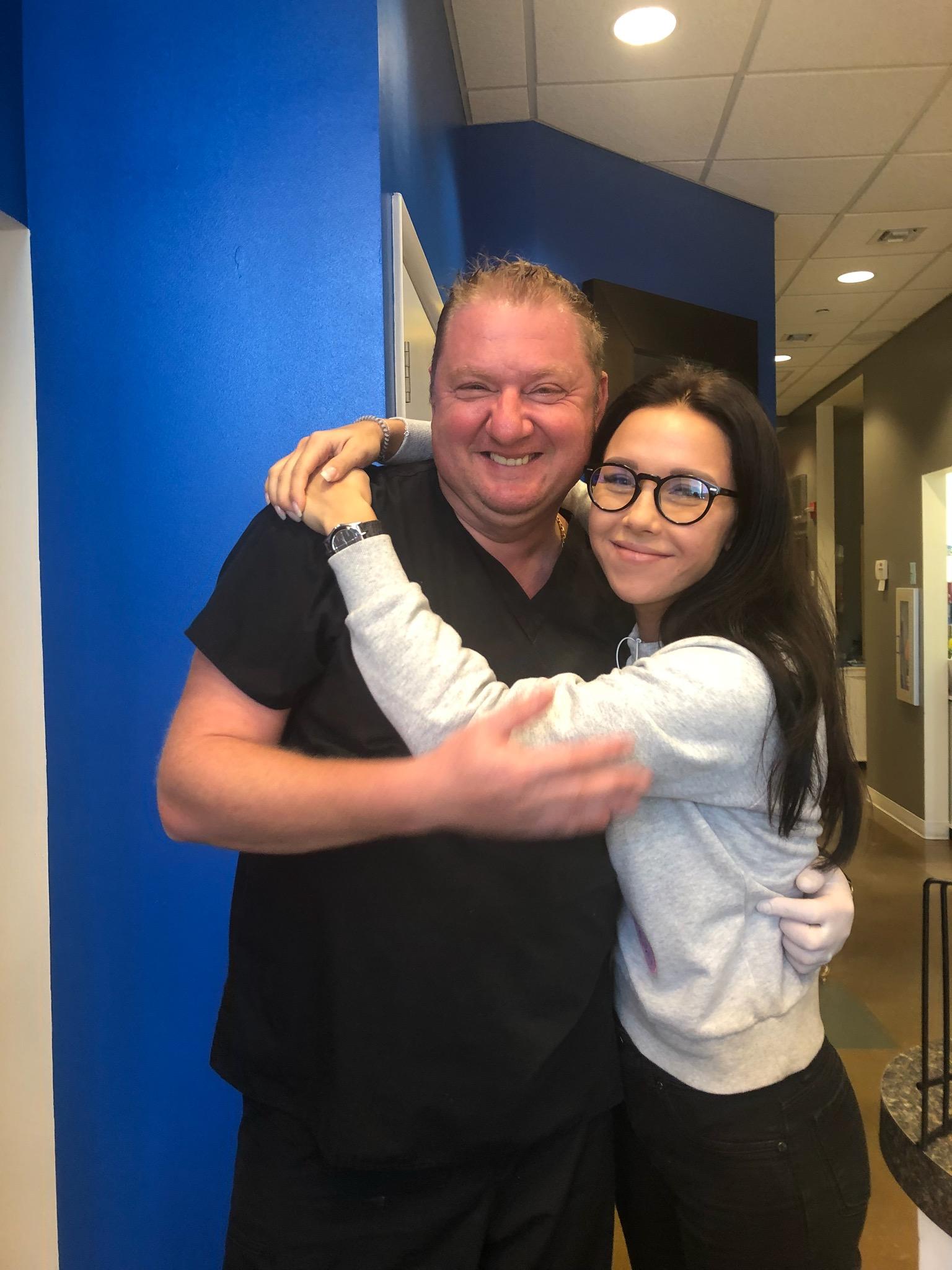 Dr. Illya Freyberg  posing with a young girl