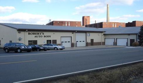 woman driving to a car body repair shop in Lawrenceburg, IN