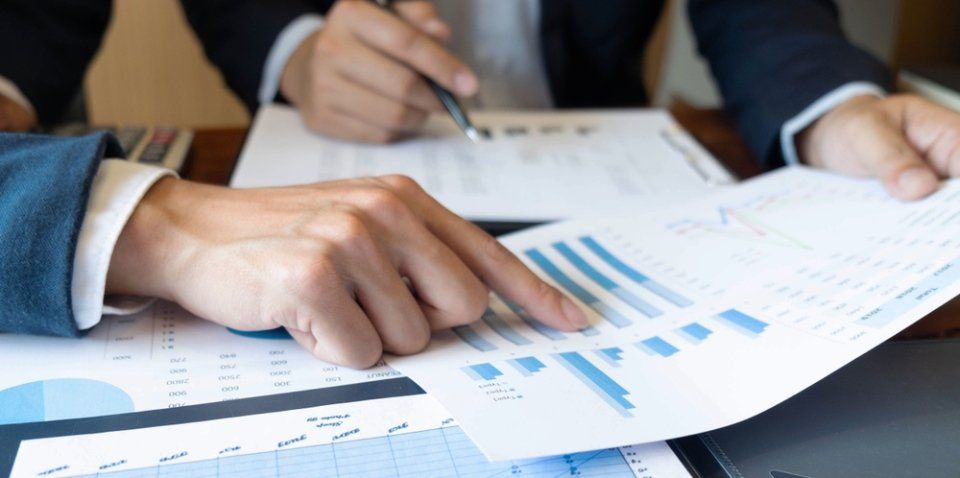 man pointing to a graph