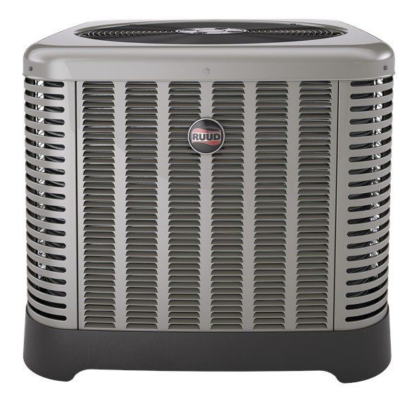 A gray Ruud outdoor air conditioning condenser unit with a black base and protective metal louvers.