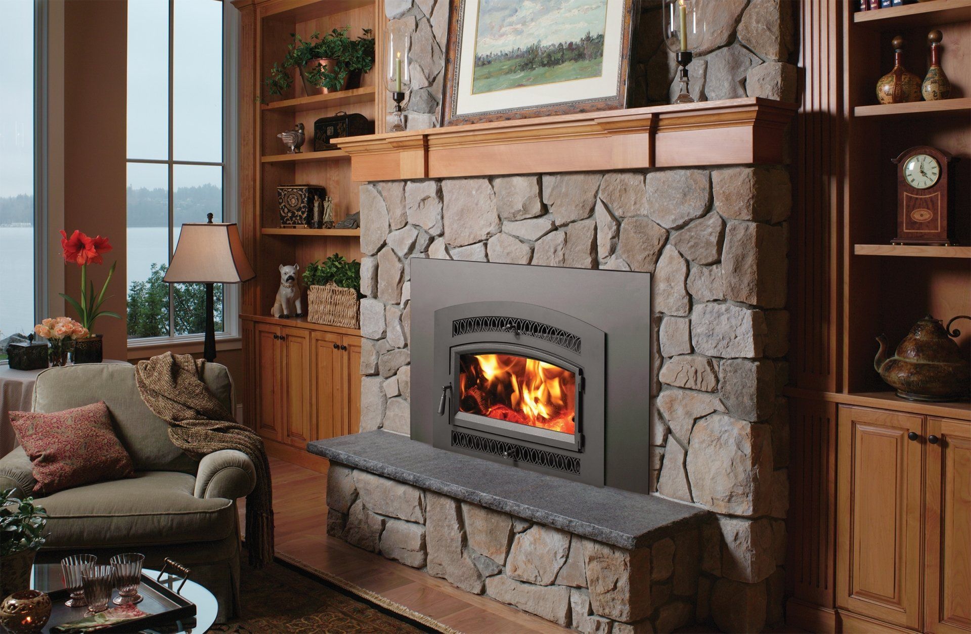 Fireplace with stone surround, wooden mantel, and built-in bookshelves in a living room.