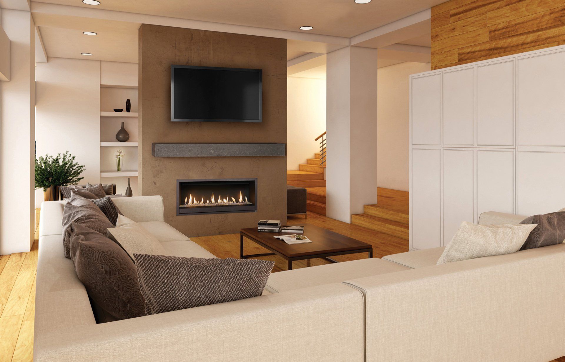 Living room with white sectional sofa, fireplace, TV, and wooden staircase.