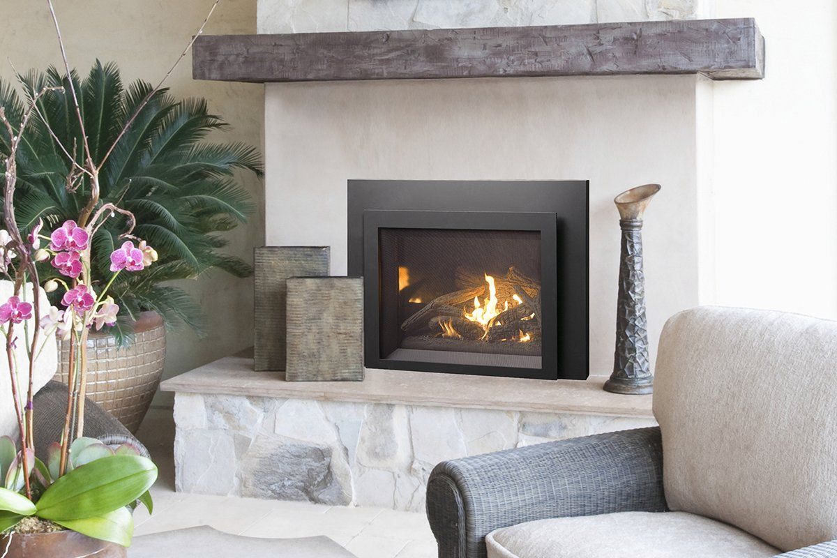 Outdoor fireplace with stone hearth, burning fire, and decorative plants.