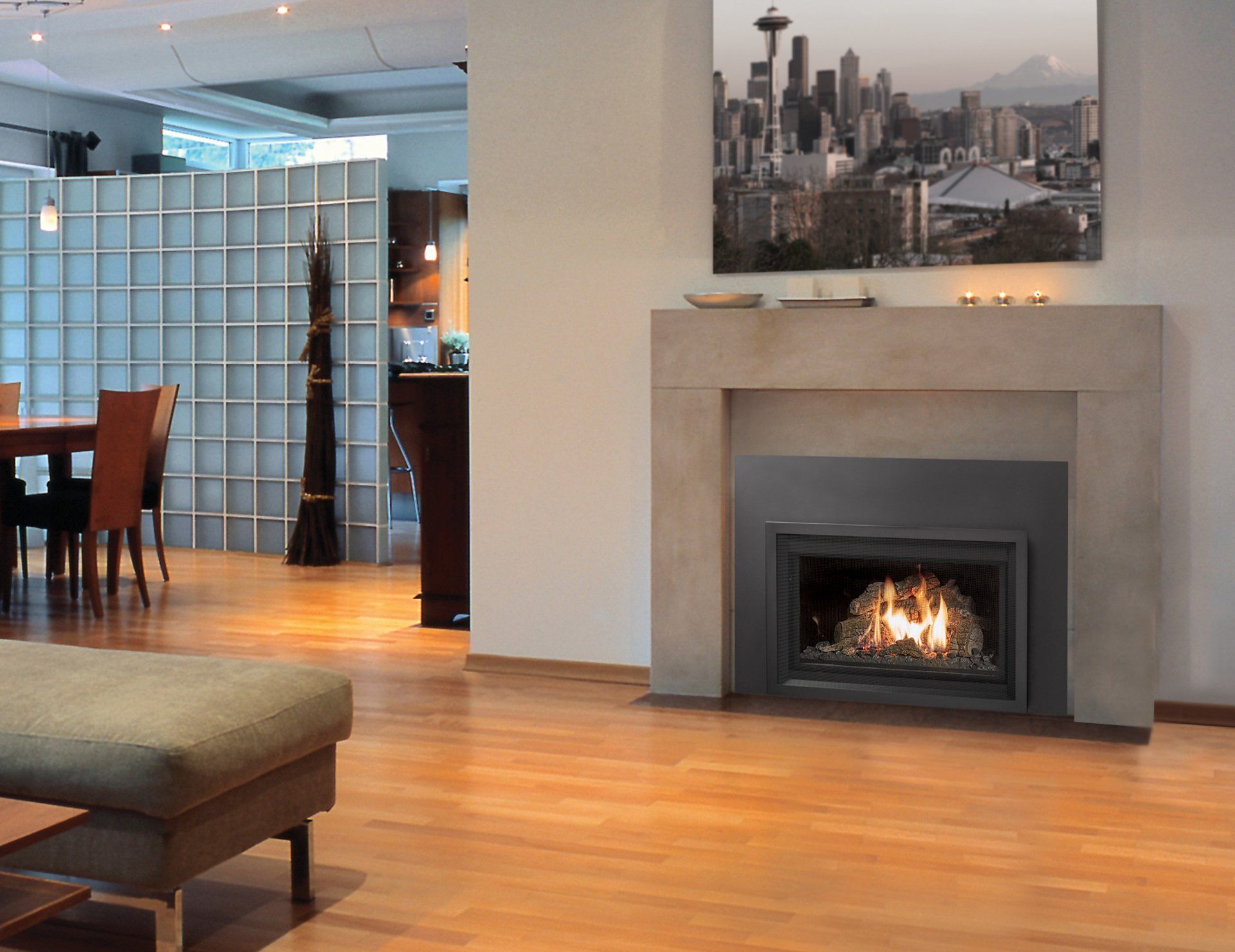Modern living room with a lit fireplace, wooden floor, and a Seattle cityscape print.