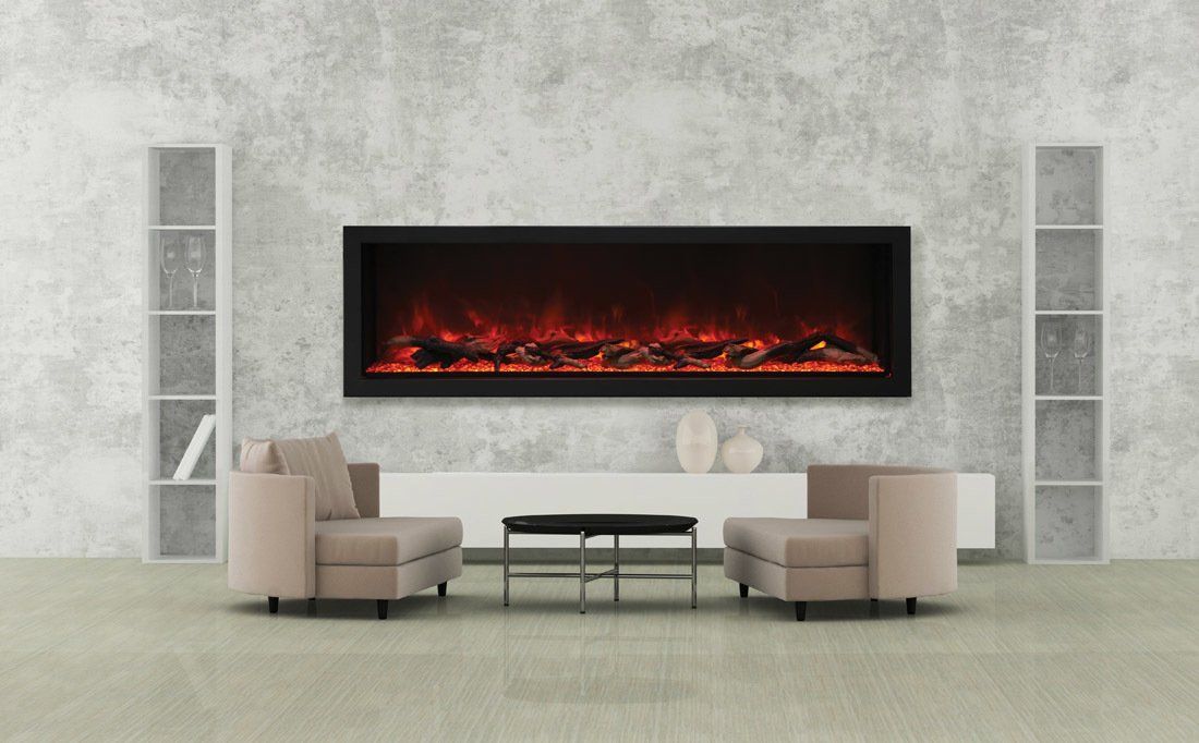 Modern living room with electric fireplace, armchairs, and shelves against a concrete wall.
