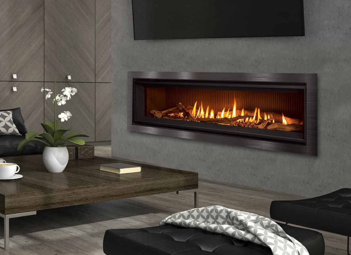 Modern living room with a lit linear fireplace, a dark wood coffee table, and minimalist furniture.