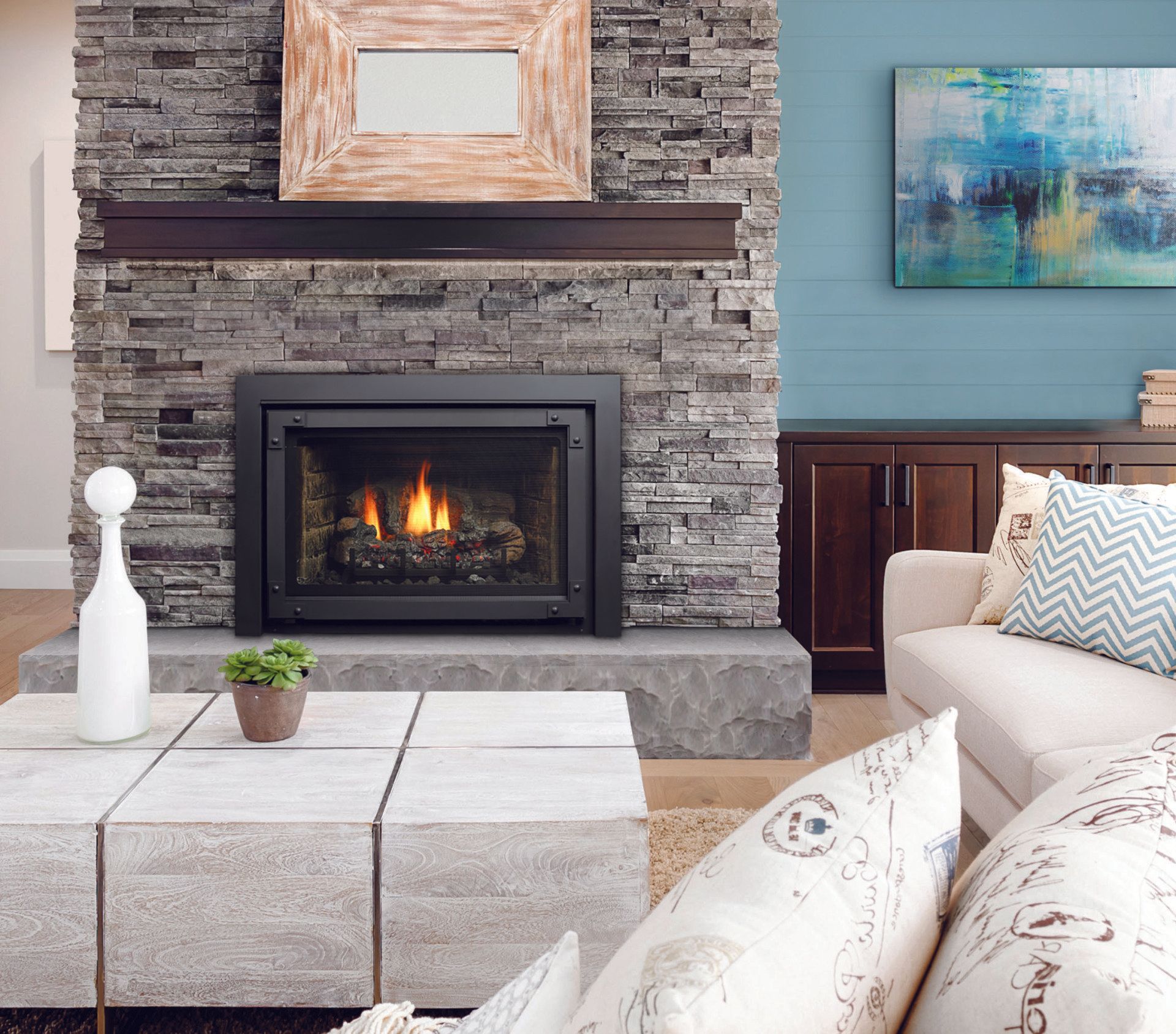Fireplace with stone surround, dark mantel, lit fire, modern living room.