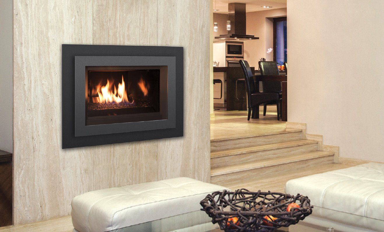 Fireplace in a modern living room. Flames, black surround, beige walls, white ottomans, glass table.