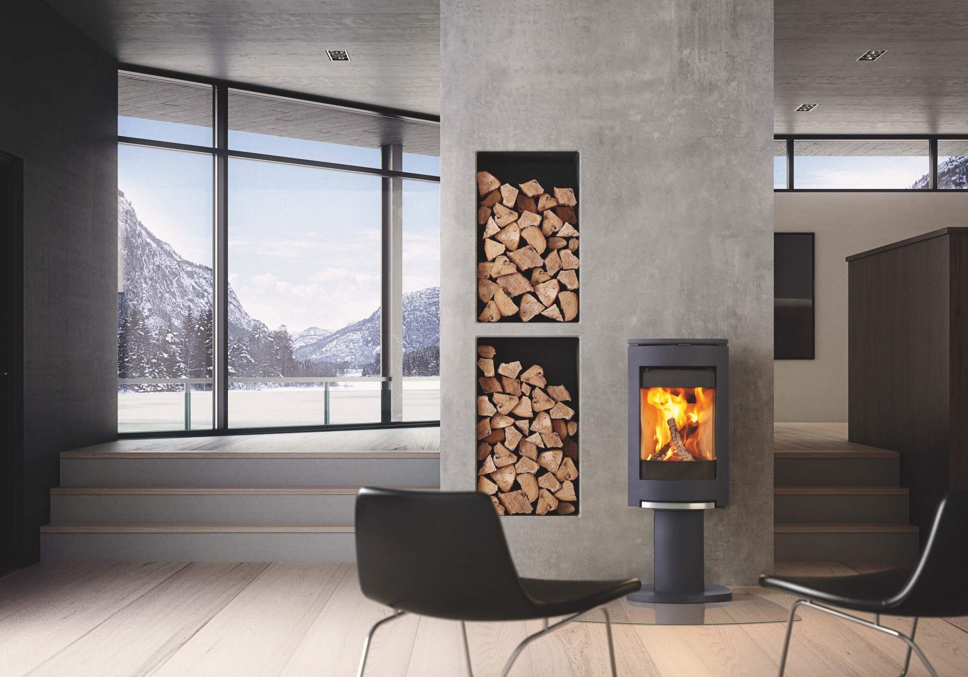 Modern living room with fireplace, wood storage niches, and a snowy mountain view.