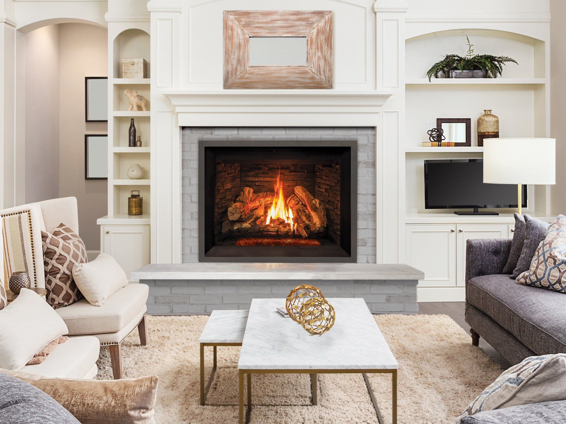 Living room with fireplace, built-in shelving, white walls, and a grey sofa and chairs.
