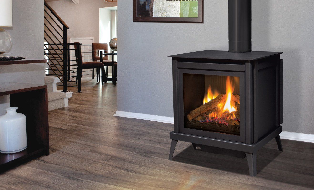 Black gas fireplace with flames, in a modern home setting.