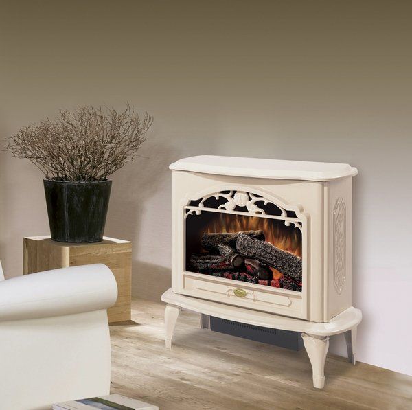 Cream-colored electric fireplace with decorative carved details, logs, and flames, next to a plant and a gold cube.