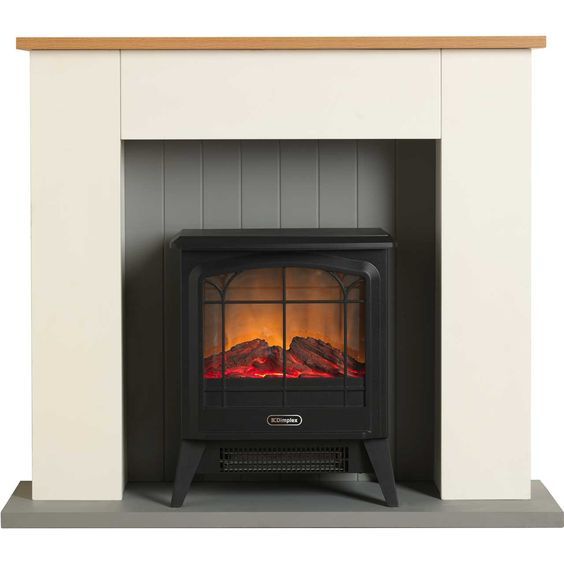 Electric fireplace with black stove inside a cream and wood mantel.