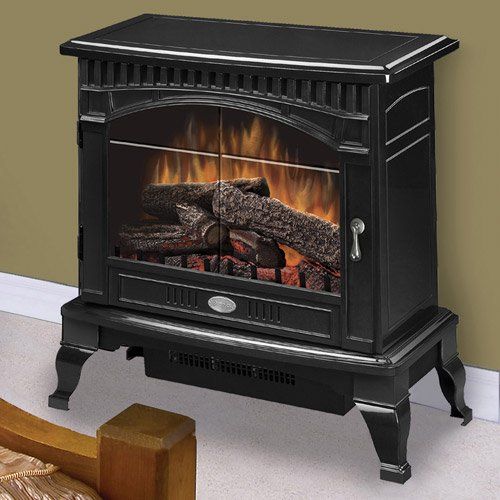 Black electric fireplace with faux fire and logs, set on a raised base, against a beige wall.