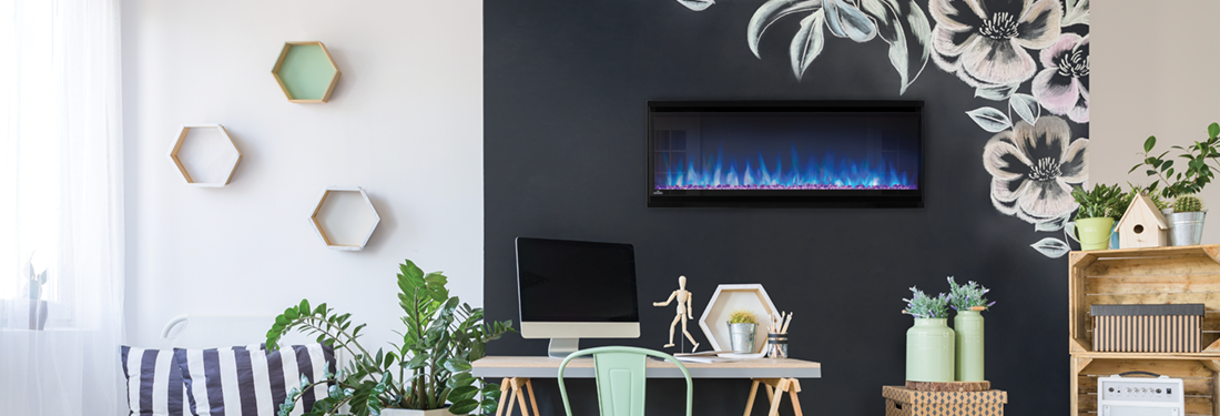 A room with a fireplace, desk, and floral wall decor. White and black walls with hexagonal shelves and a large floral mural.