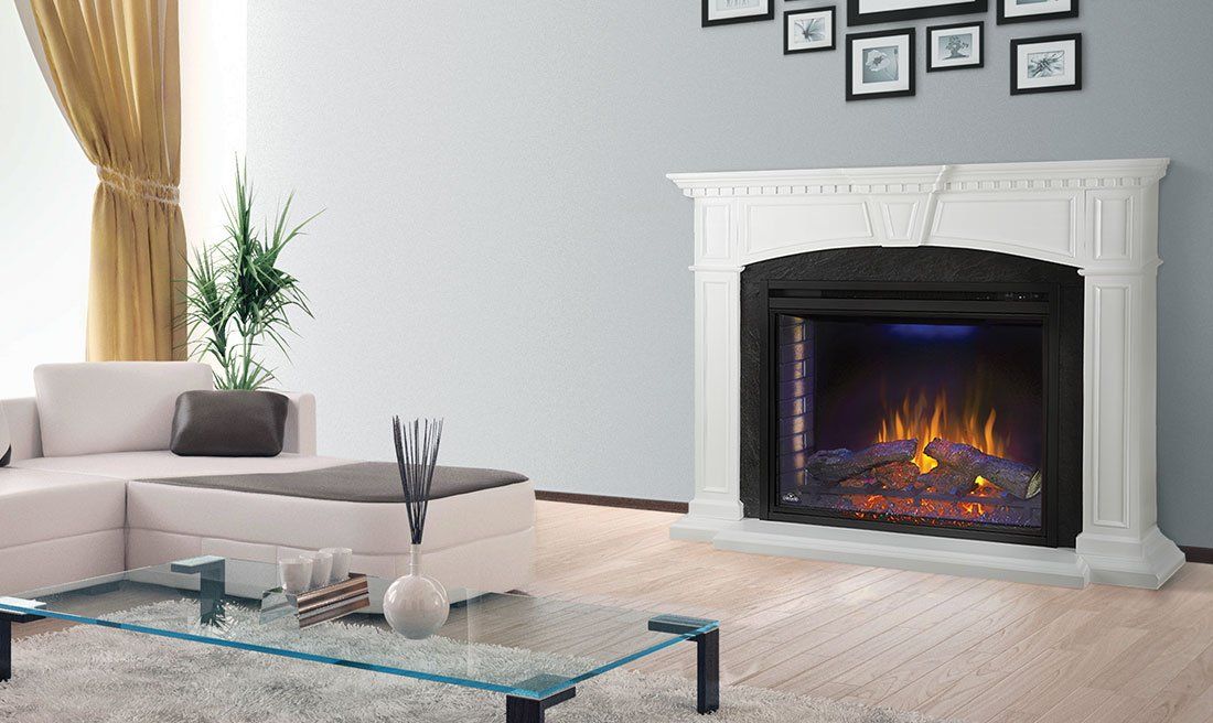 Living room with a white fireplace, couch, and glass coffee table.