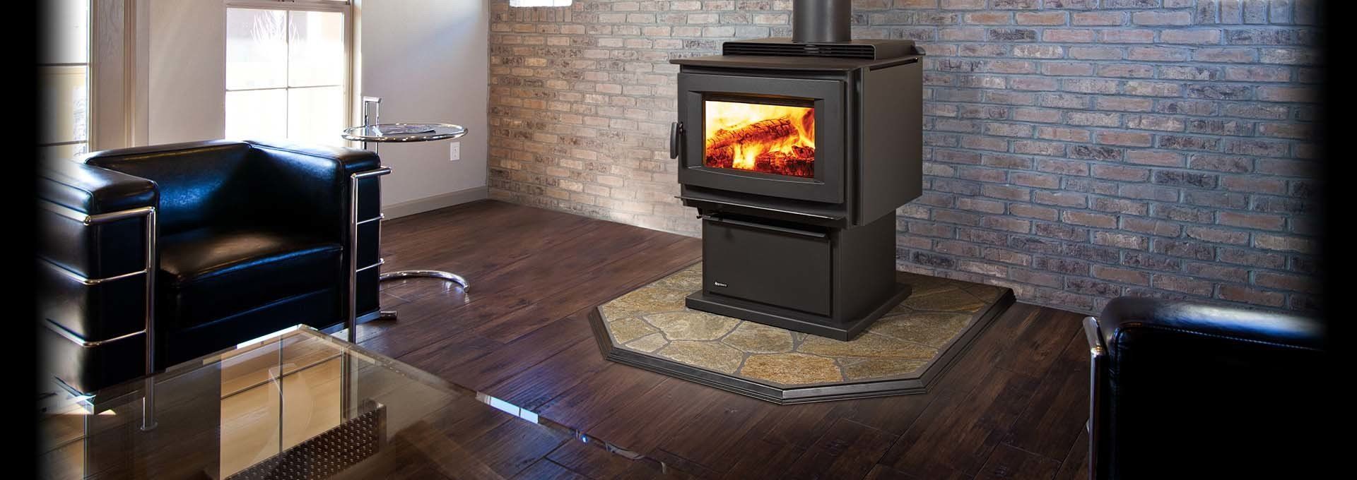 A lit wood-burning stove in a modern living room with a black leather chair.