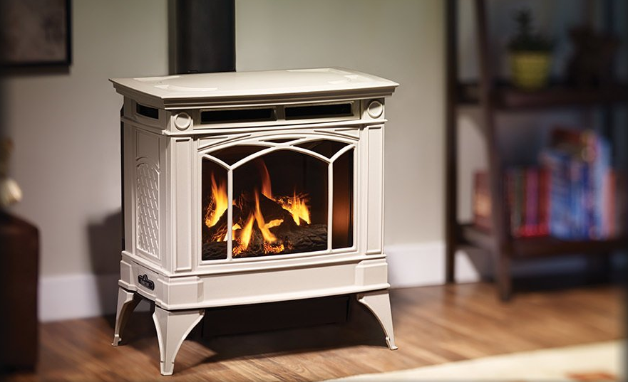 White electric fireplace with simulated flames, standing in a room with a bookshelf.