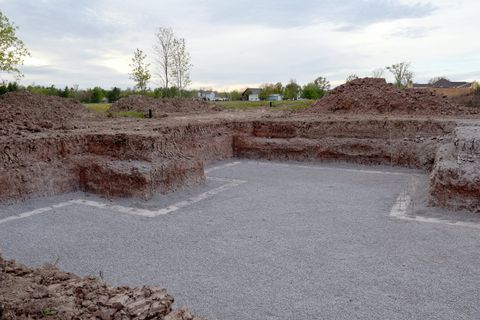 Excavator digging for a basement — Gordonsville, TN — Crockett-Phillips Construction Inc. Excavator digging for a basement — Gordonsville, TN — Crockett-Phillips Construction Inc.