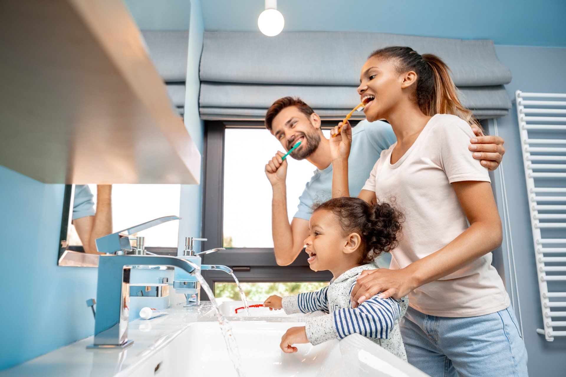 Family Brushing Their Teeth — Saranac, MI — Dr. John McRee, D.D.S, P.C.