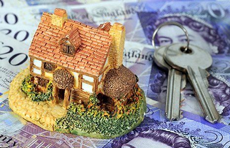 model of a home and keys