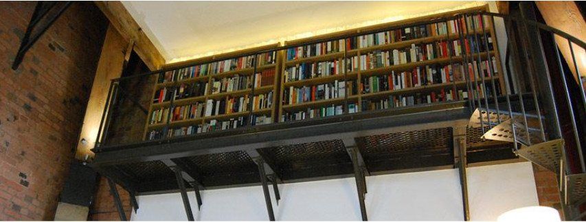 The library mezzanine accessed via the spiral staircase
