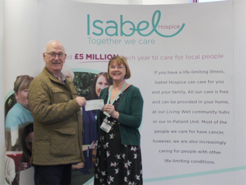 Immediate Past Master, Norman Hollands presents a cheque for £500 to the Isabel Hospice